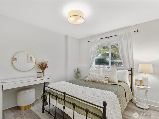 455 Newport Way NW Unit 302, Issaquah, WA 98027 - bedroom featuring wood finished floors and baseboards