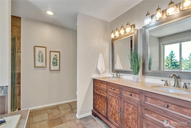full bathroom with a sink, double vanity, and a tile shower