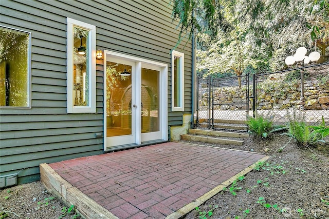 exterior space featuring visible vents, fence, and a gate