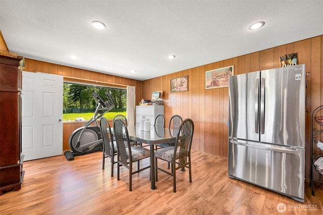 206 Kelly Rd, Bellingham, WA 98226 - dining room featuring light wood-style floors, wooden walls, and recessed lighting