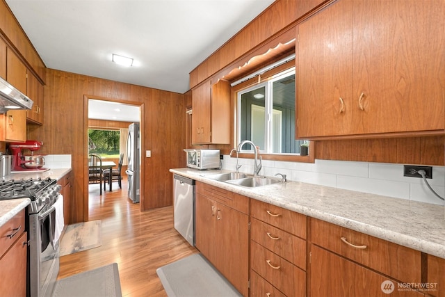 206 Kelly Rd, Bellingham, WA 98226 - kitchen with a sink, backsplash, light wood-style floors, light countertops, and appliances with stainless steel finishes