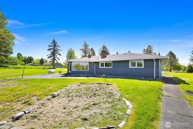 206 Kelly Rd, Bellingham, WA 98226 - view of front of home featuring a patio area, a front lawn, a chimney, and crawl space