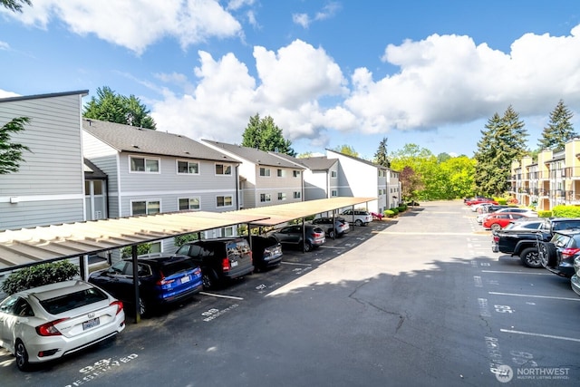 covered parking lot with a residential view