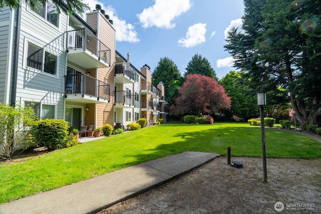 surrounding community with a lawn