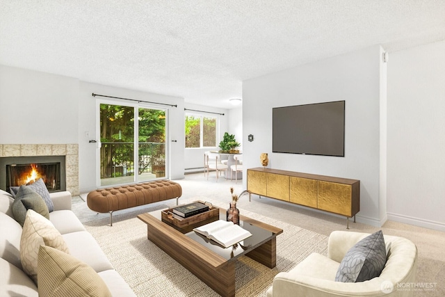 carpeted living room with a tile fireplace, a textured ceiling, and baseboards