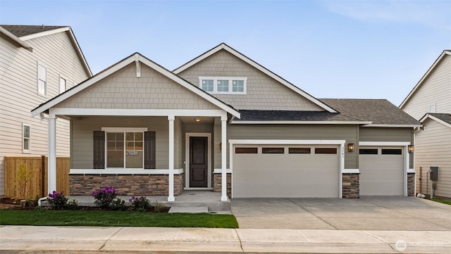 5741 Thornhill Ave SW Unit 326, Port Orchard, WA 98367 - craftsman house with stone siding, an attached garage, driveway, and covered porch