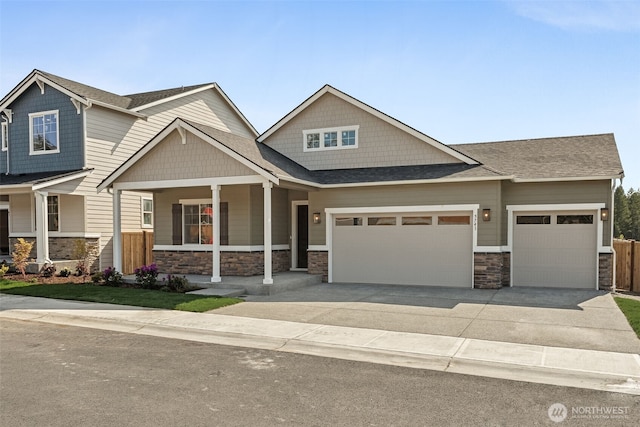 5741 Thornhill Ave SW Unit 326, Port Orchard, WA 98367 - craftsman inspired home with an attached garage, stone siding, driveway, and a porch