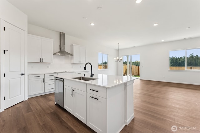 5741 Thornhill Ave SW Unit 326, Port Orchard, WA 98367 - kitchen featuring wall chimney range hood, a sink, stainless steel dishwasher, light countertops, and dark wood-style flooring