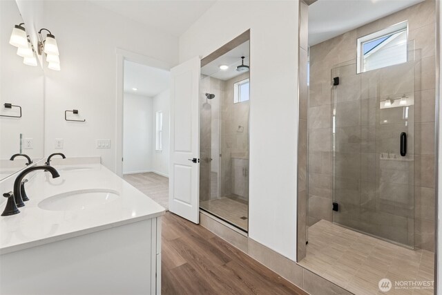 5741 Thornhill Ave SW Unit 326, Port Orchard, WA 98367 - bathroom featuring a stall shower, healthy amount of natural light, wood finished floors, and recessed lighting