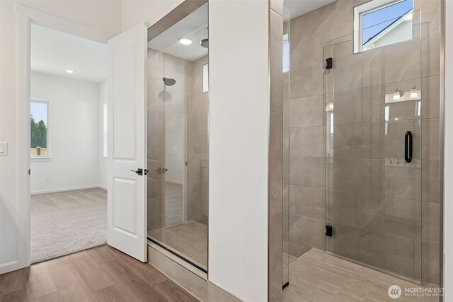 5741 Thornhill Ave SW Unit 326, Port Orchard, WA 98367 - full bath featuring plenty of natural light, a stall shower, and wood finished floors