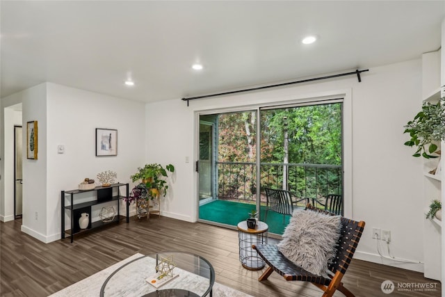 sitting room featuring wood finished floors, baseboards, and recessed lighting