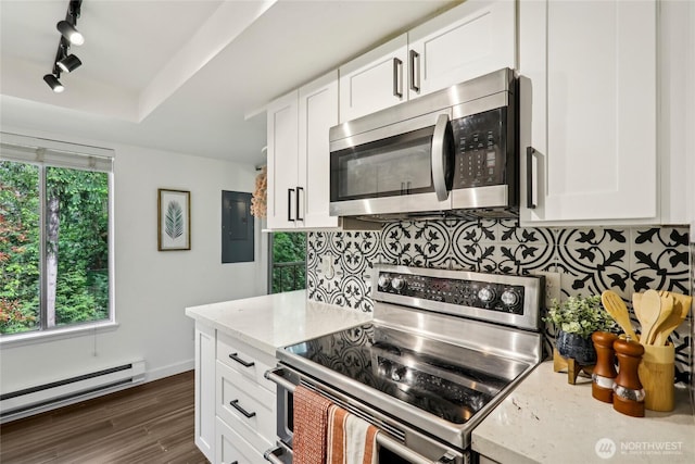 kitchen with stainless steel appliances, a baseboard heating unit, electric panel, and white cabinets
