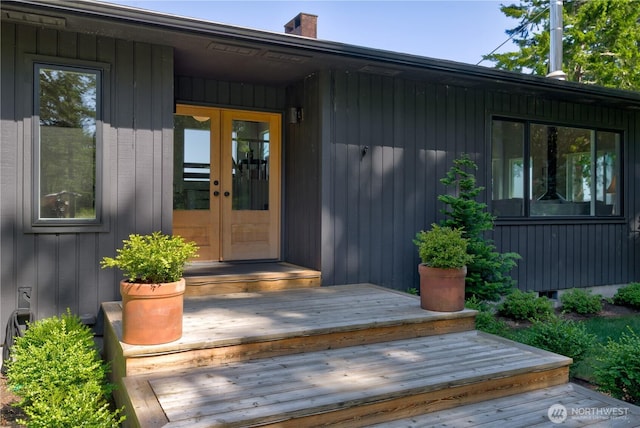 15410 Sandridge Rd, Long Beach, WA 98631 - doorway to property with a chimney, french doors, and a deck