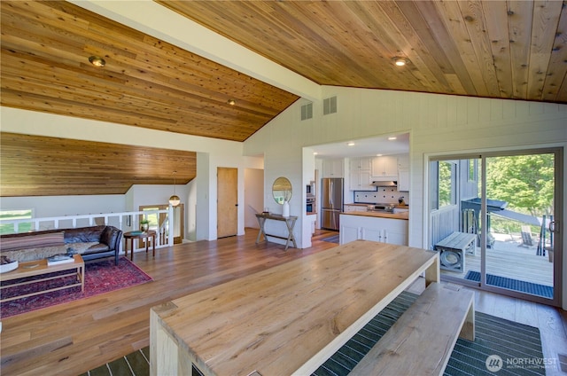 15410 Sandridge Rd, Long Beach, WA 98631 - dining room featuring lofted ceiling, wood ceiling, dark wood finished floors, and recessed lighting