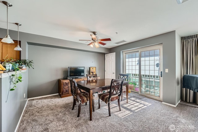 3201 Pacific Ave Unit 305, Tacoma, WA 98418 - carpeted dining space featuring baseboards and a ceiling fan