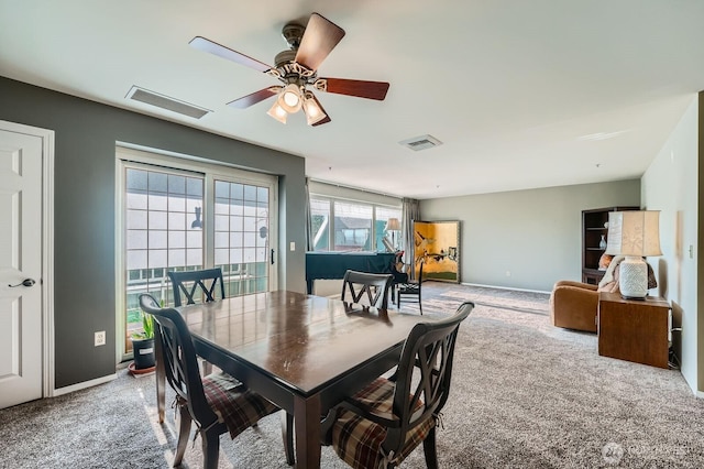 3201 Pacific Ave Unit 305, Tacoma, WA 98418 - dining room featuring carpet flooring and a ceiling fan