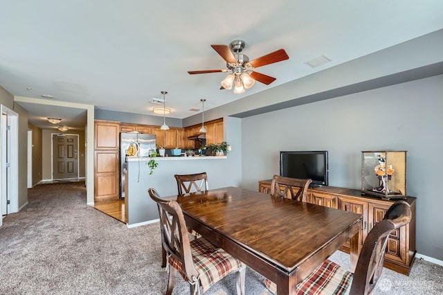 3201 Pacific Ave Unit 305, Tacoma, WA 98418 - dining area with light carpet, ceiling fan, and baseboards