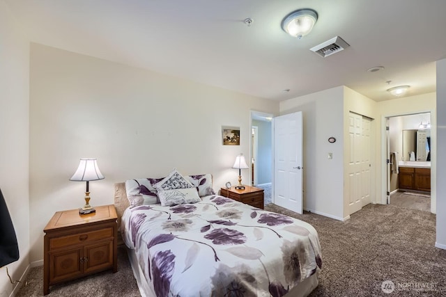 3201 Pacific Ave Unit 305, Tacoma, WA 98418 - bedroom with carpet flooring, baseboards, ensuite bath, and a closet
