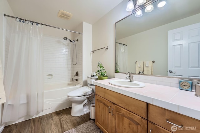 3201 Pacific Ave Unit 305, Tacoma, WA 98418 - bathroom featuring wood finished floors, shower / bath combo, vanity, and toilet