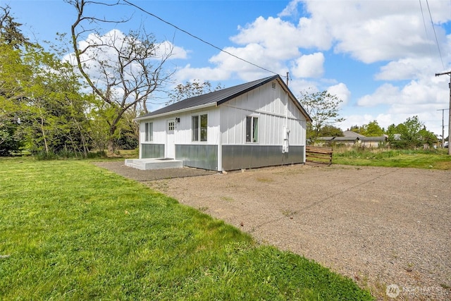 108 Centre St S, Rainier, WA 98576 - back of property featuring a lawn and metal roof