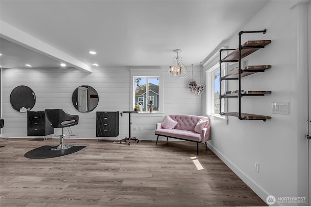 108 Centre St S, Rainier, WA 98576 - sitting room featuring wood finished floors, plenty of natural light, recessed lighting, baseboards, and wood walls