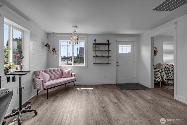 108 Centre St S, Rainier, WA 98576 - entrance foyer with wood finished floors, a chandelier, and baseboards