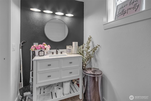 108 Centre St S, Rainier, WA 98576 - bathroom featuring vanity, baseboards, and a textured wall