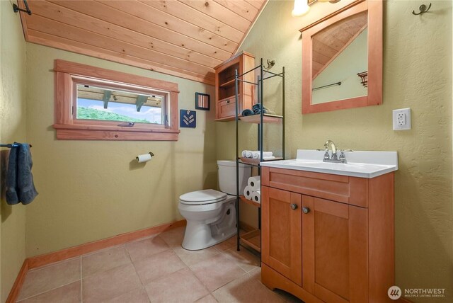 41 Red Tail Ridge Rd, Twisp, WA 98856 - bathroom featuring wooden ceiling, tile patterned flooring, toilet, vanity, and vaulted ceiling