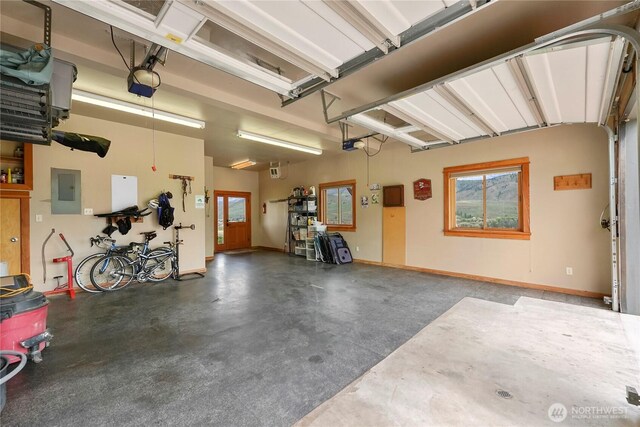 41 Red Tail Ridge Rd, Twisp, WA 98856 - garage with electric panel, a garage door opener, and baseboards