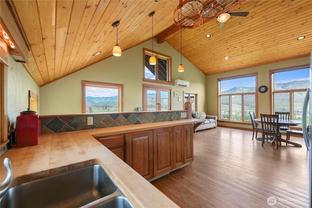 41 Red Tail Ridge Rd, Twisp, WA 98856 - kitchen featuring wood counters, dark wood-style flooring, wood ceiling, hanging light fixtures, and brown cabinetry