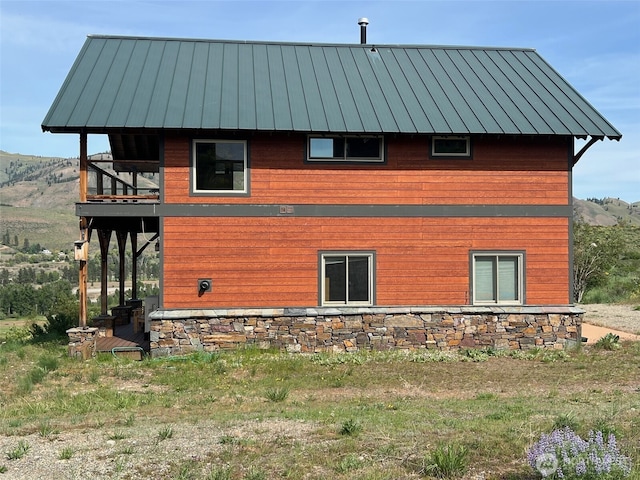 41 Red Tail Ridge Rd, Twisp, WA 98856 - view of side of home with metal roof, a standing seam roof, and a balcony
