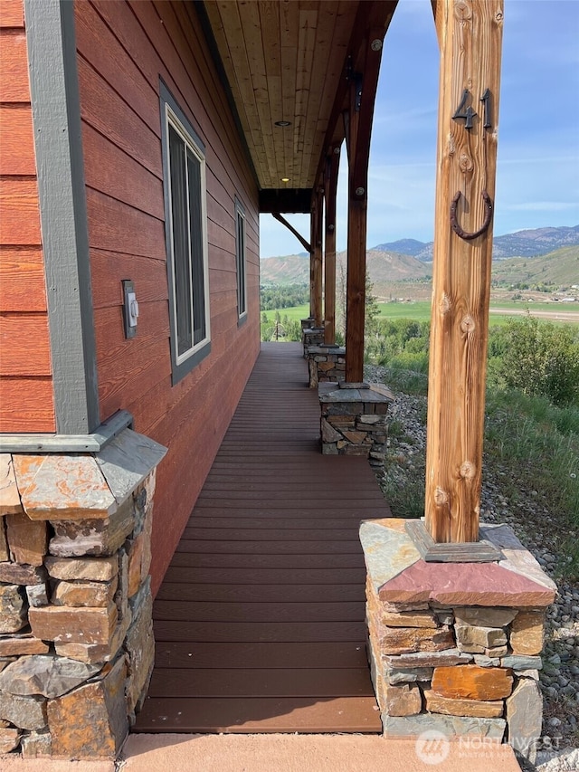 41 Red Tail Ridge Rd, Twisp, WA 98856 - wooden terrace with a mountain view and covered porch