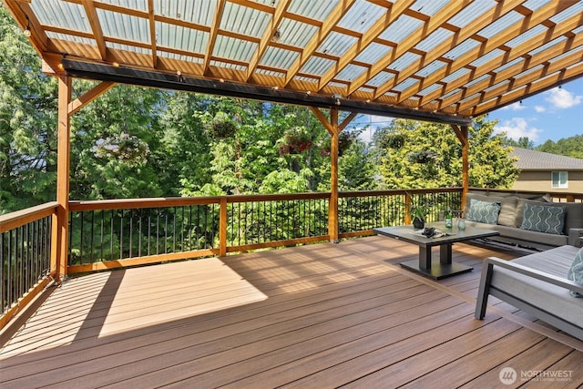 wooden terrace featuring an outdoor hangout area and a pergola