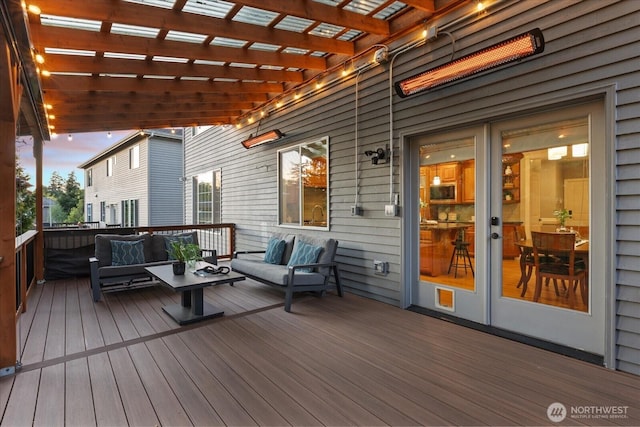 wooden deck featuring an outdoor living space and a pergola