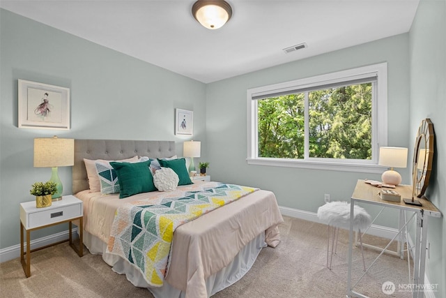 bedroom featuring baseboards and carpet flooring