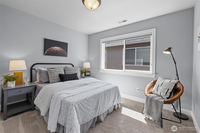 bedroom featuring carpet flooring and baseboards