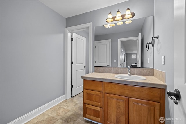bathroom featuring vanity and baseboards