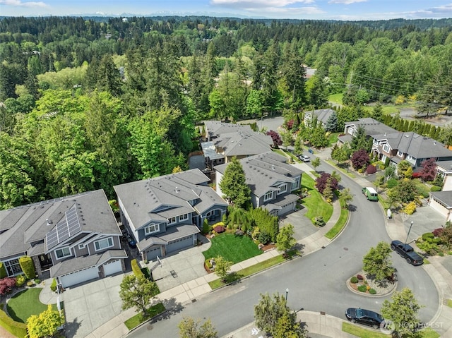 aerial perspective of suburban area with a heavily wooded area