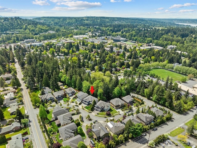 aerial view of residential area with a forest