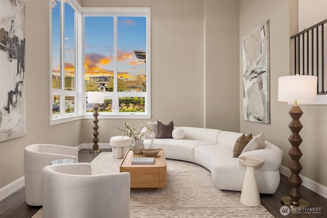 living room featuring baseboards and wood finished floors