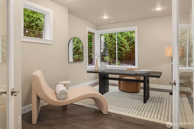 interior space with recessed lighting, baseboards, visible vents, and wood finished floors