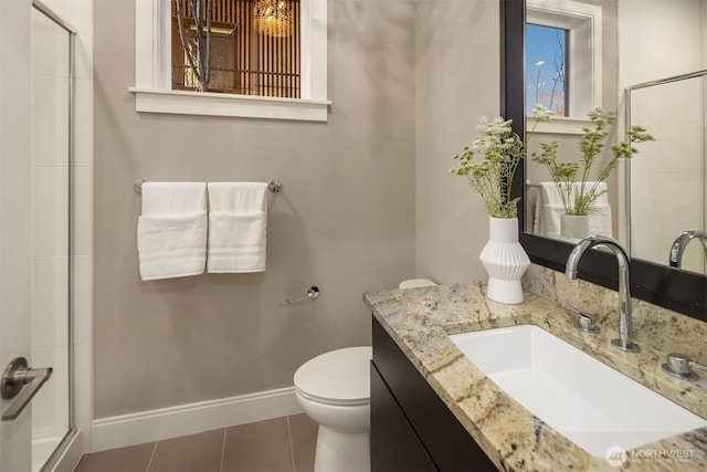 full bath featuring a stall shower, toilet, and tile patterned floors