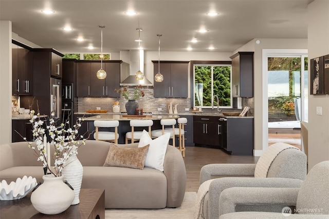 living room featuring light wood-style floors and recessed lighting