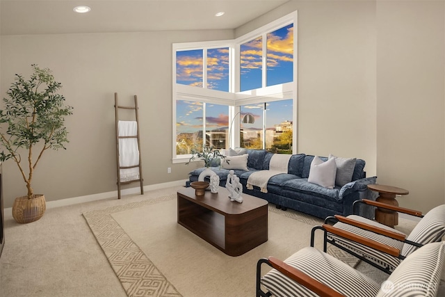 living area featuring baseboards, carpet flooring, and recessed lighting
