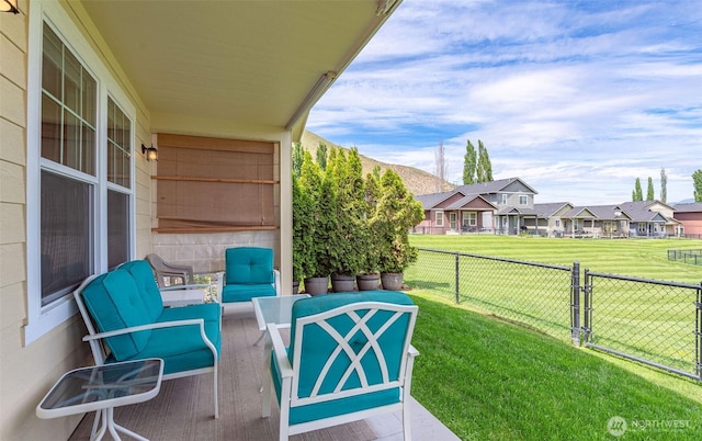balcony with an outdoor hangout area, a residential view, and a patio