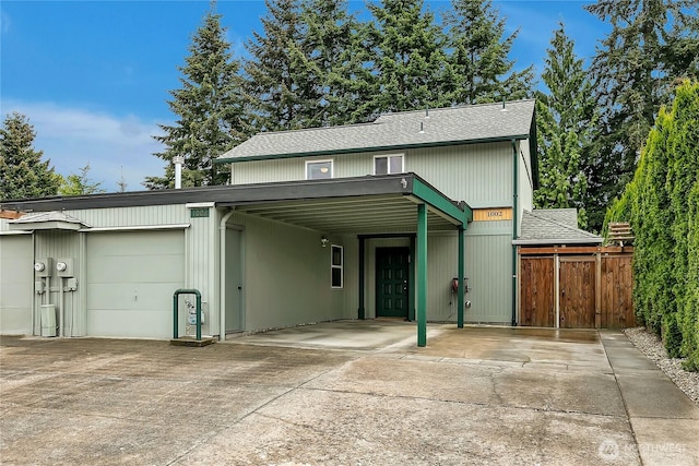1002 30th St NE, Auburn, WA 98002 - view of front facade featuring concrete driveway and roof with shingles