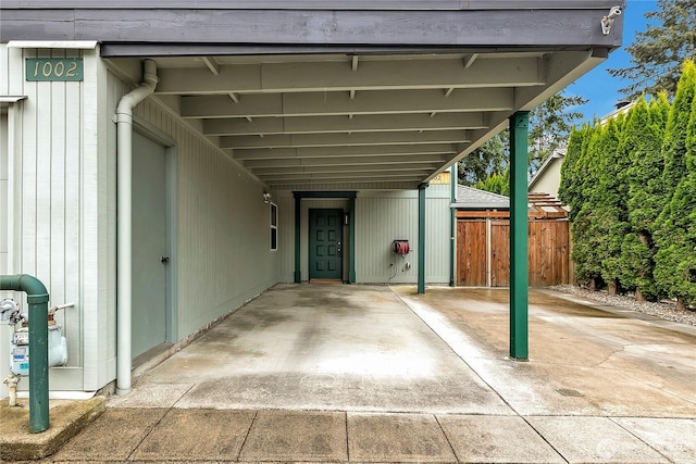 1002 30th St NE, Auburn, WA 98002 - view of patio featuring an attached carport