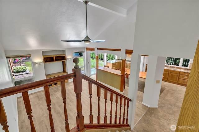 1002 30th St NE, Auburn, WA 98002 - staircase with ceiling fan, high vaulted ceiling, and beam ceiling