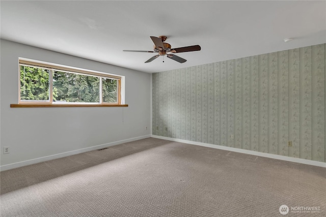 1002 30th St NE, Auburn, WA 98002 - empty room with ceiling fan, carpet, and baseboards