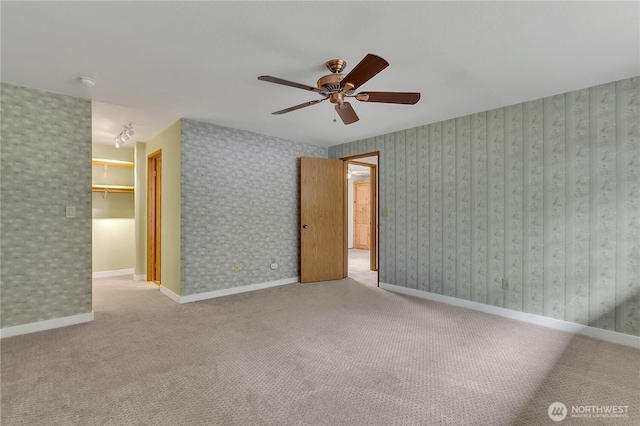 1002 30th St NE, Auburn, WA 98002 - unfurnished room with a ceiling fan, carpet flooring, a smoke detector, and baseboards
